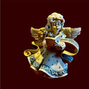 Caroling angel figurine